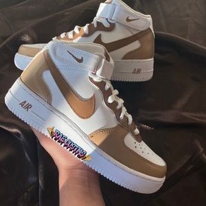 Tan and white Nike shoes